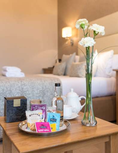 Victoria Hotel Standard Room Accommodation Drinks and Flowers by Bed