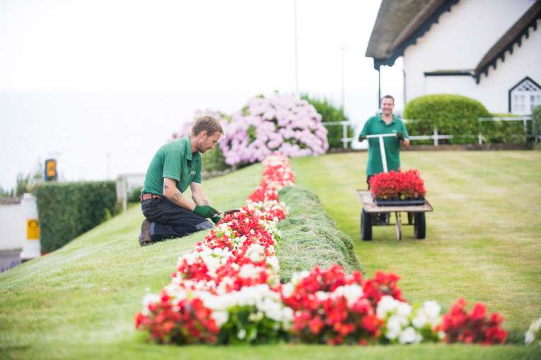 Victoria Hotel Gardeners Tending to Flower Beds