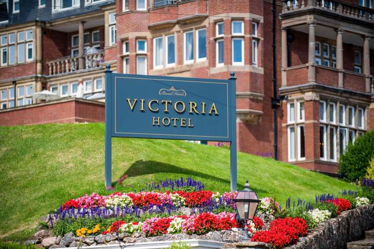 Victoria Hotel Exterior with Sign