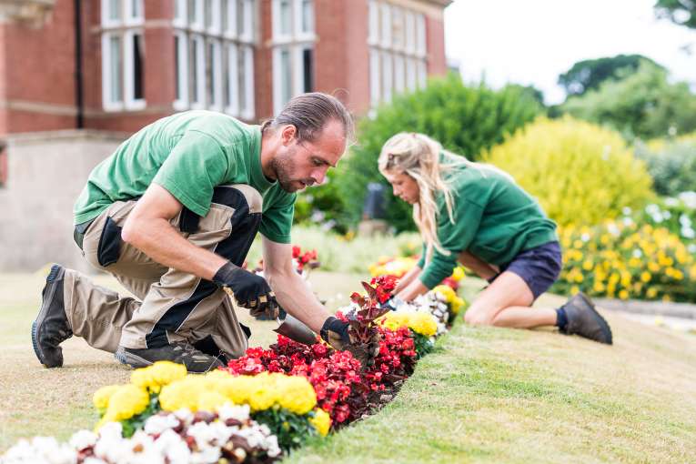 Garden Staff Looking After Flowers at Victoria Hotel
