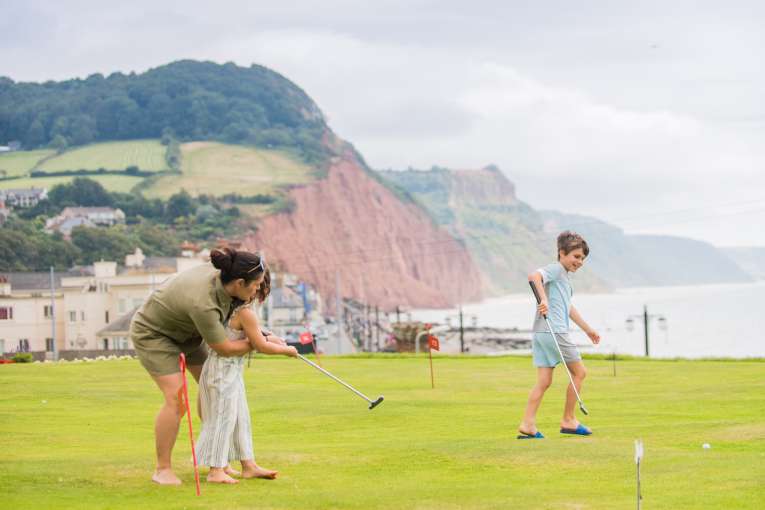 Mother and Children on Putting Green in Sidmouth