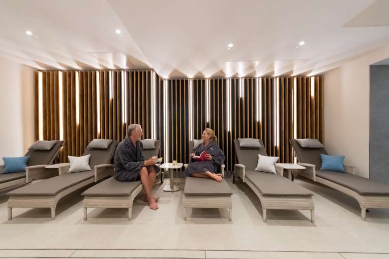 Couple talking in relaxation area 