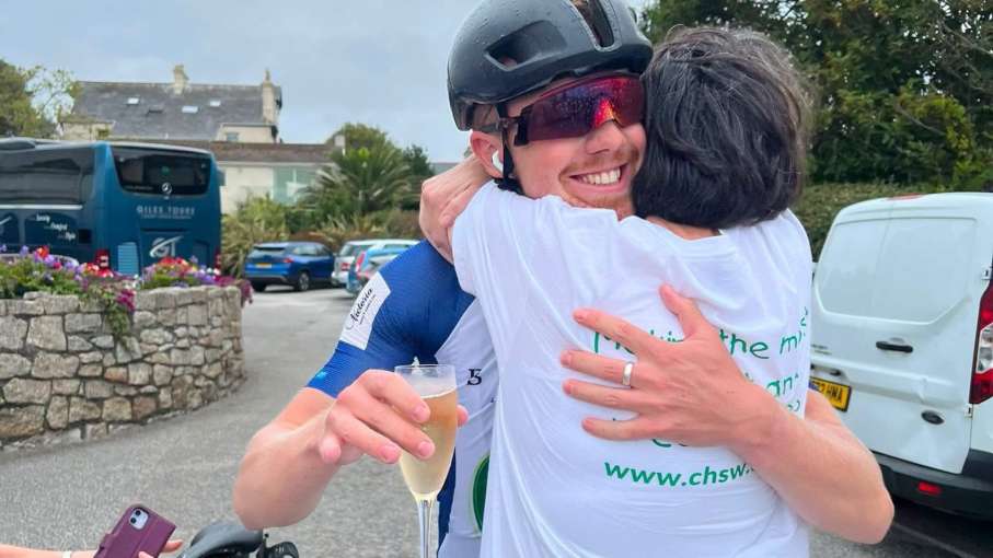 Aidan hugging fellow Brend Hotel Employee