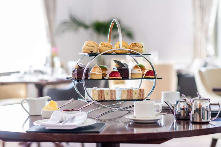 Afternoon Tea on a wooden table in The White Room
