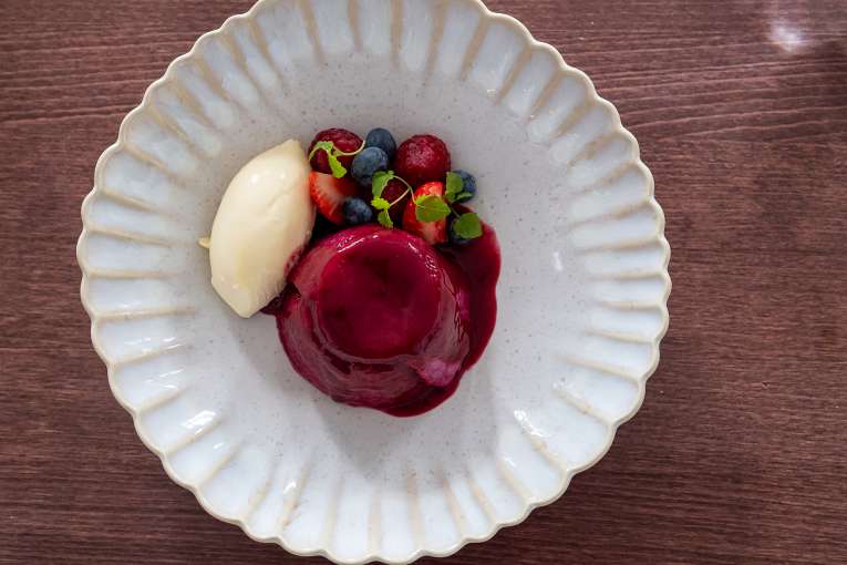 Dessert on a wooden table in The White Room