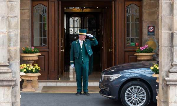 Victoria Hotel Doorman Greeting Arriving Car