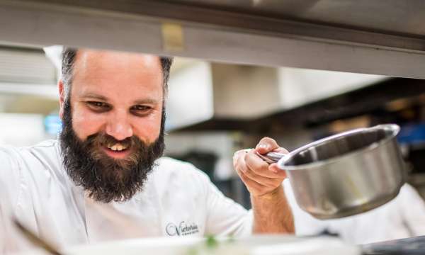 Head Chef Stuart White at The Victoria Hotel in Sidmouth preparing dinner in the restaurant kitchen