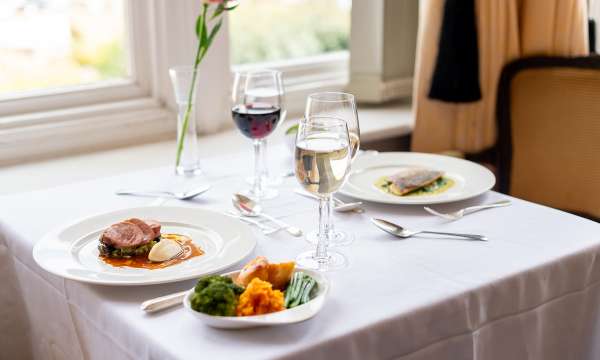 Beef and fish dish on a table in the Jubilee Restaurant at The Victoria Hotel
