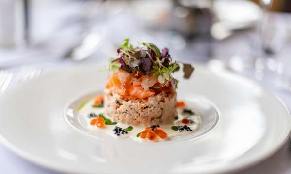 Salmon dish on a white plate in The Jubilee Restaurant