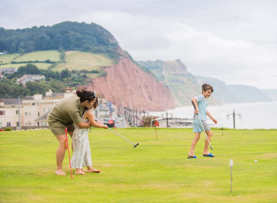 Victoria Hotel Mother and Children Enjoying a Game on the Putting Green