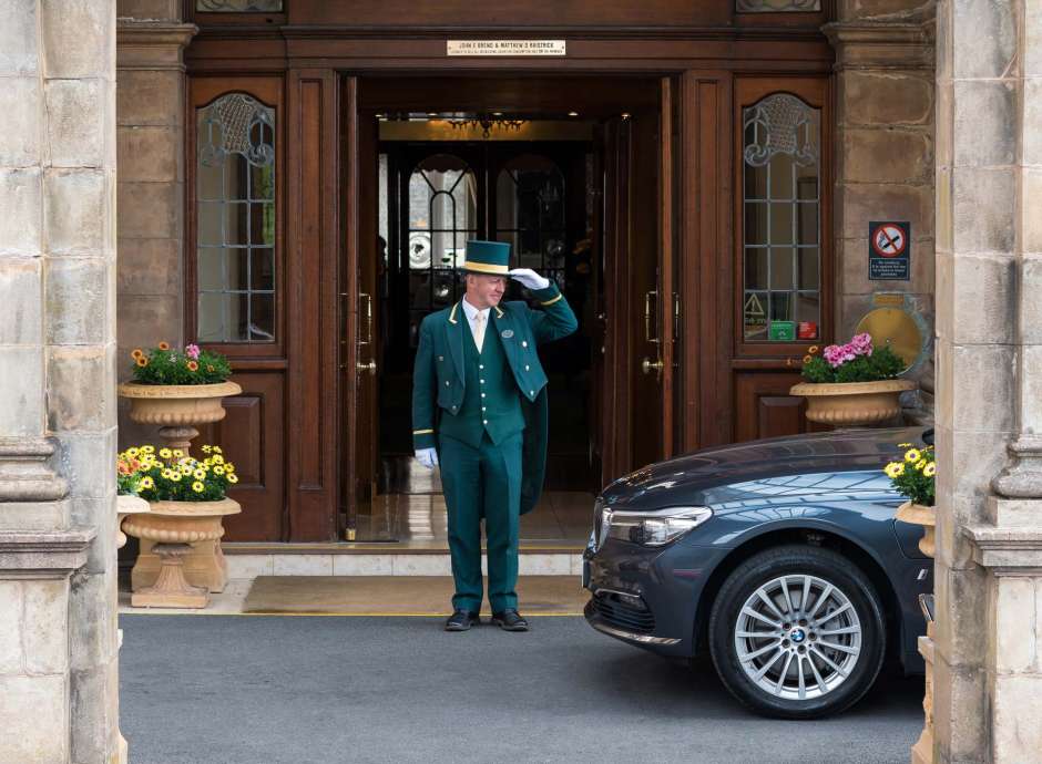Victoria Hotel Doorman Greeting Arriving Car
