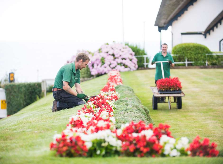 Victoria Hotel Gardeners Tending to Flower Beds