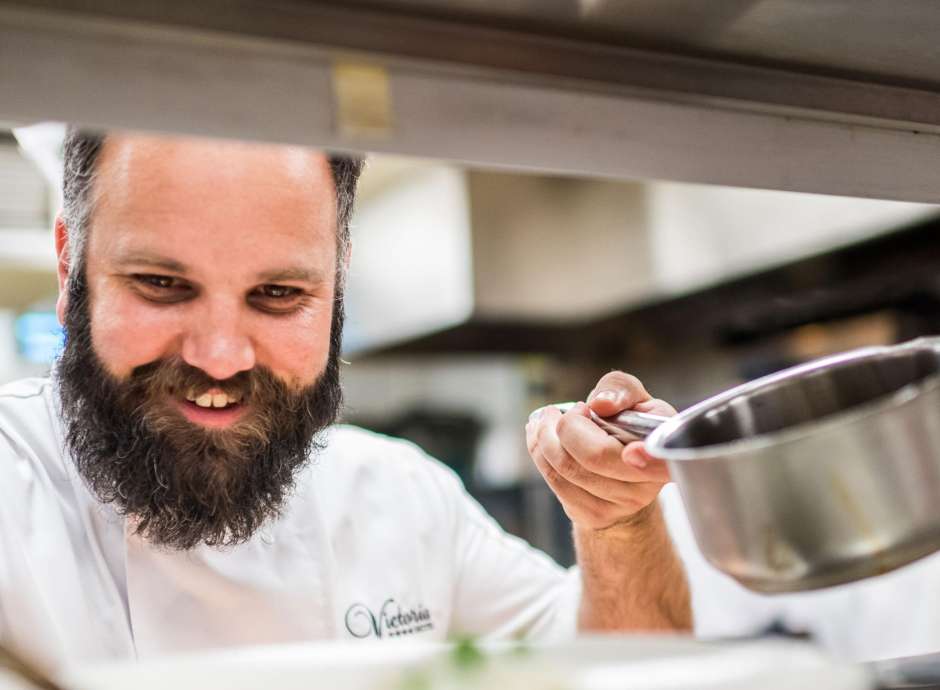 Head Chef Stuart White at The Victoria Hotel in Sidmouth preparing dinner in the restaurant kitchen