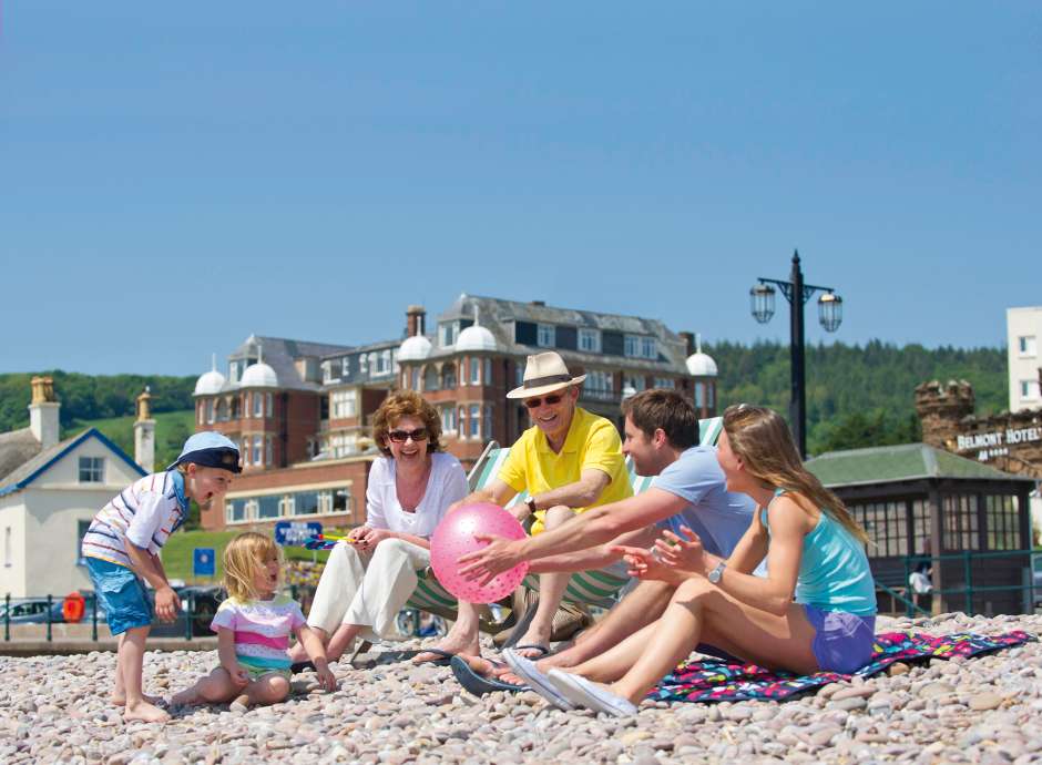 Family at Sidmouth Beach by Victoria Hotel