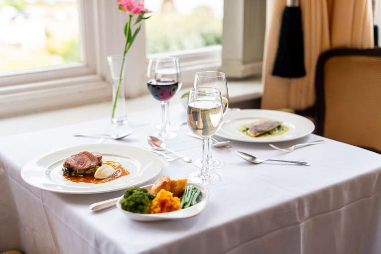 Beef and fish dish on a table in the Jubilee Restaurant at The Victoria Hotel