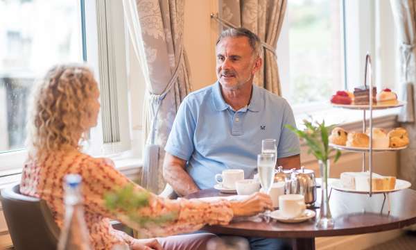 Couple Enjoying Afternoon Tea at White Room